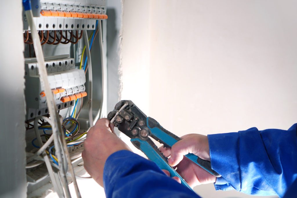 Electrician fixing electrical panel