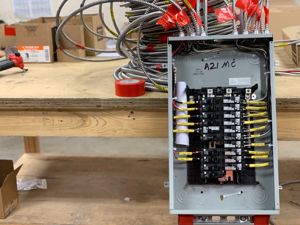 open electrical panel with circuit breakers visible 