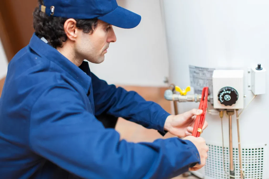 Technician repairing water heater