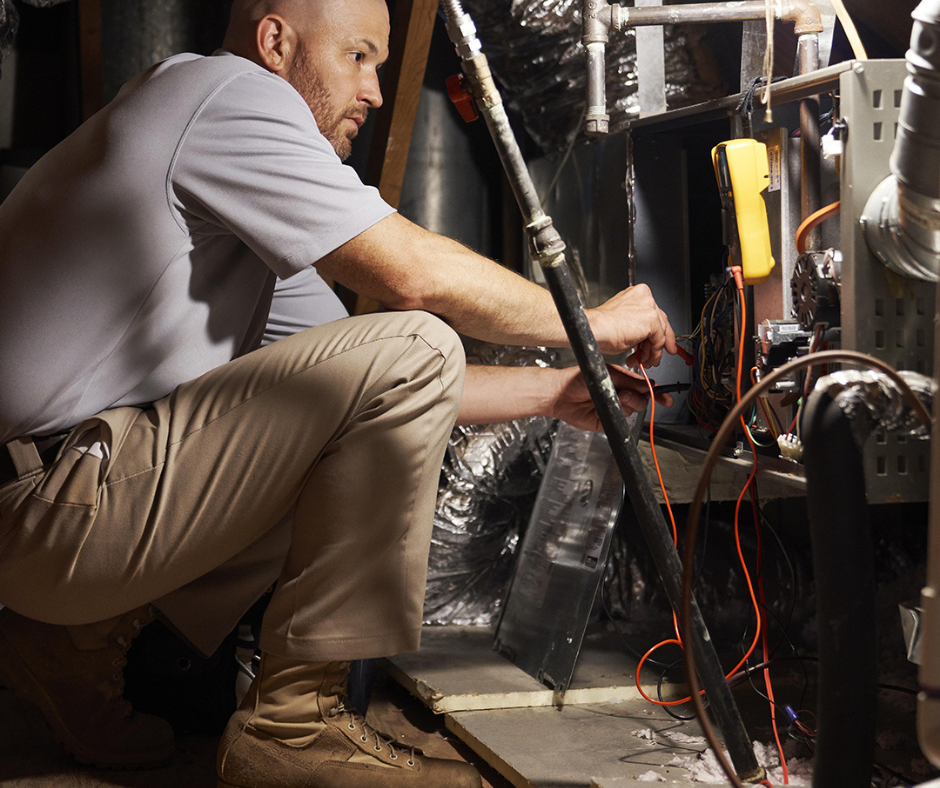 HVAC professional installing an new gas heating system in a home - Blind and Sons Heating Services