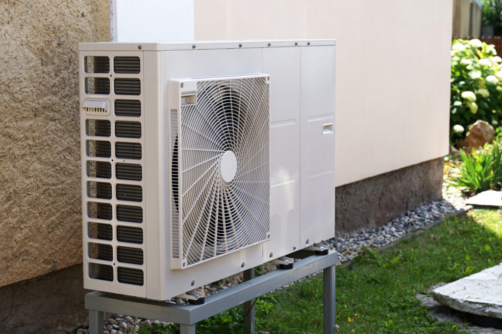 Heat pump outdoor unit in modern house